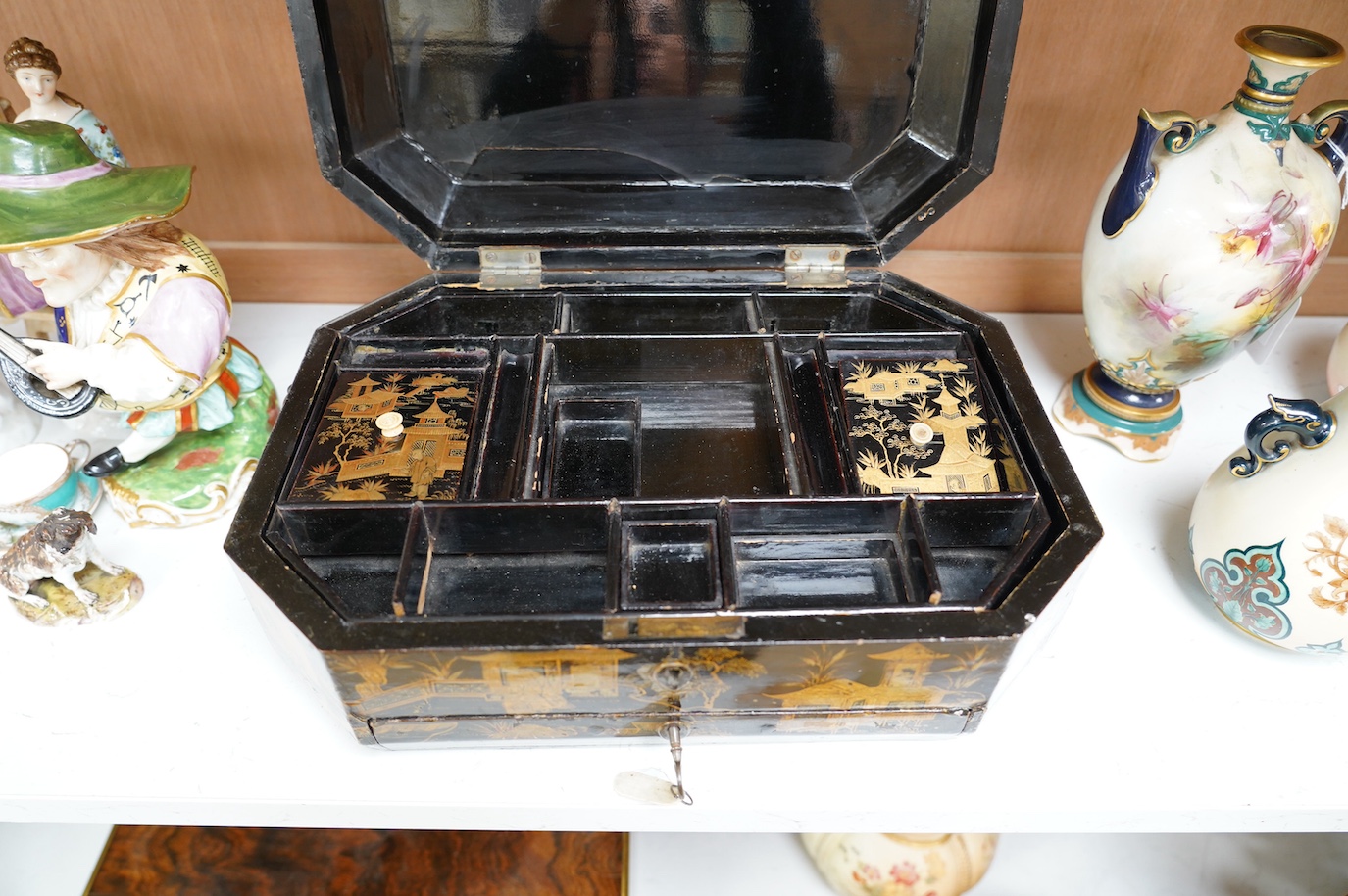 A 19th century Chinese lacquered sewing box, 33.5cm wide. Condition - fair, generally worn